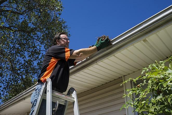 damaged gutter being fixed with new materials in Florissant
